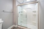 Indulge in the Steam with the Lower Level Bathroom and its Rain Shower Head